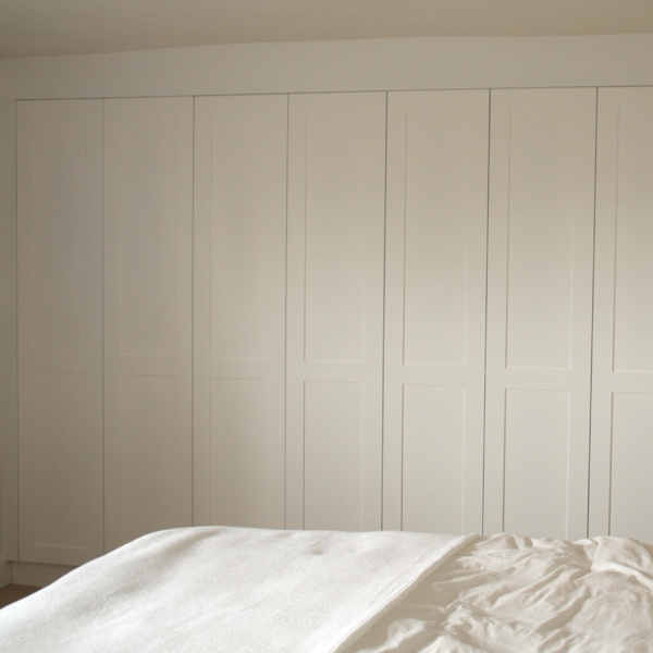 Bank of fitted bedroom wardrobes